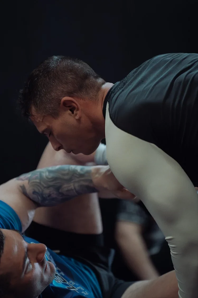 Adult practitioners grappling intensely during live rolling at Lucid Jiu Jitsu in Hewlett NY