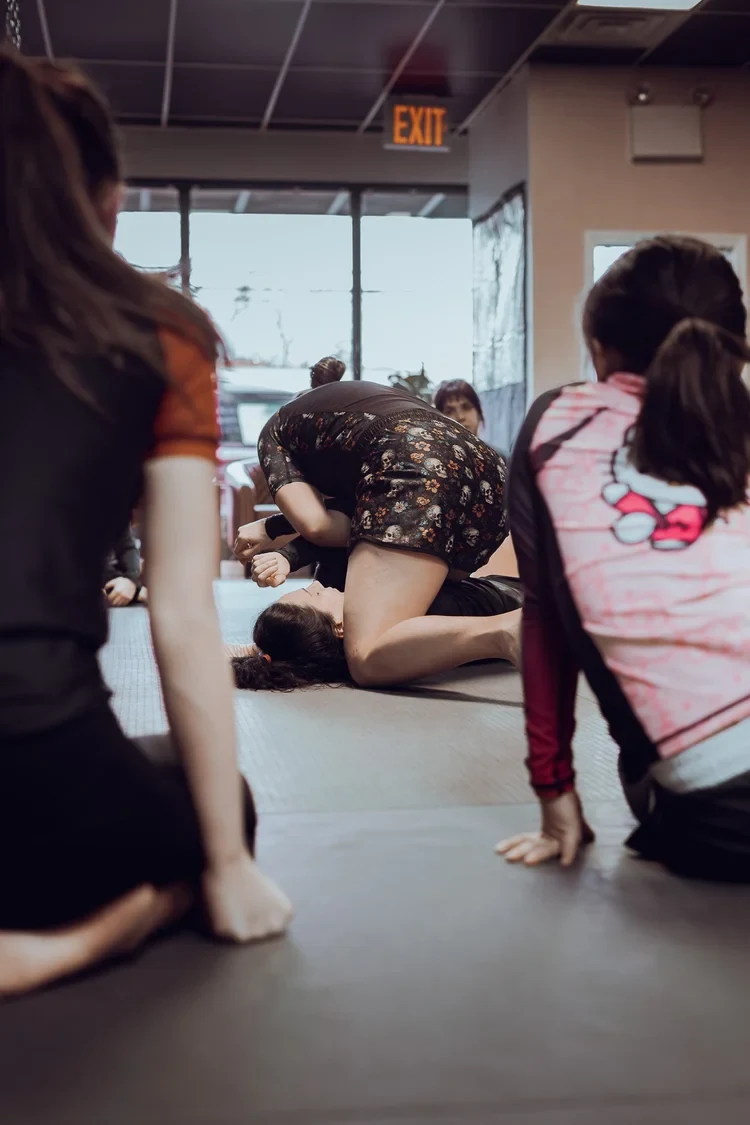 Kids practicing jiu jitsu on the mat during a structured class at Lucid Jiu Jitsu in Hewlett NY
